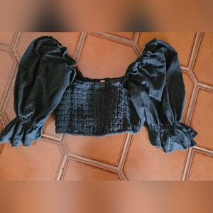 The Free People black Smocked Boho Crop Sorella Top in size L for women is a sty